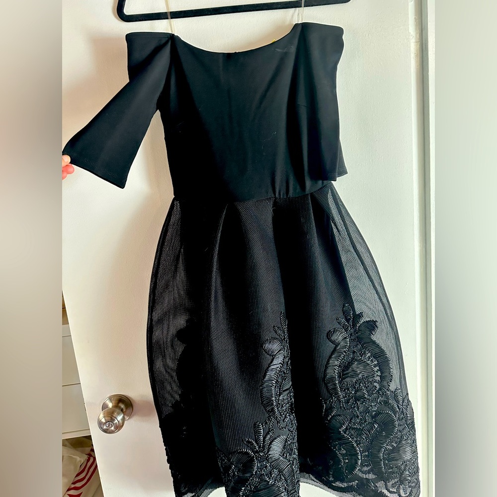 Black off the shoulder dress from Akira.